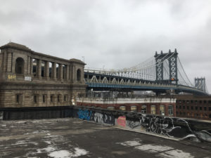 Photograph of the Manhattan Bridge and skyline from the JPG Legal roof on 68 Jay Street in DUMBO, Brooklyn.
